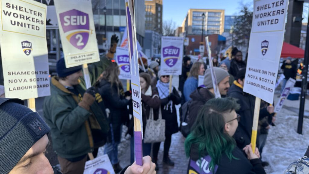 About 100 supporters came out to show their solidarity with shelter workers at The Bridge.